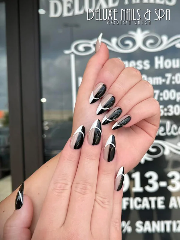 Black almond nails with sparkling accent details