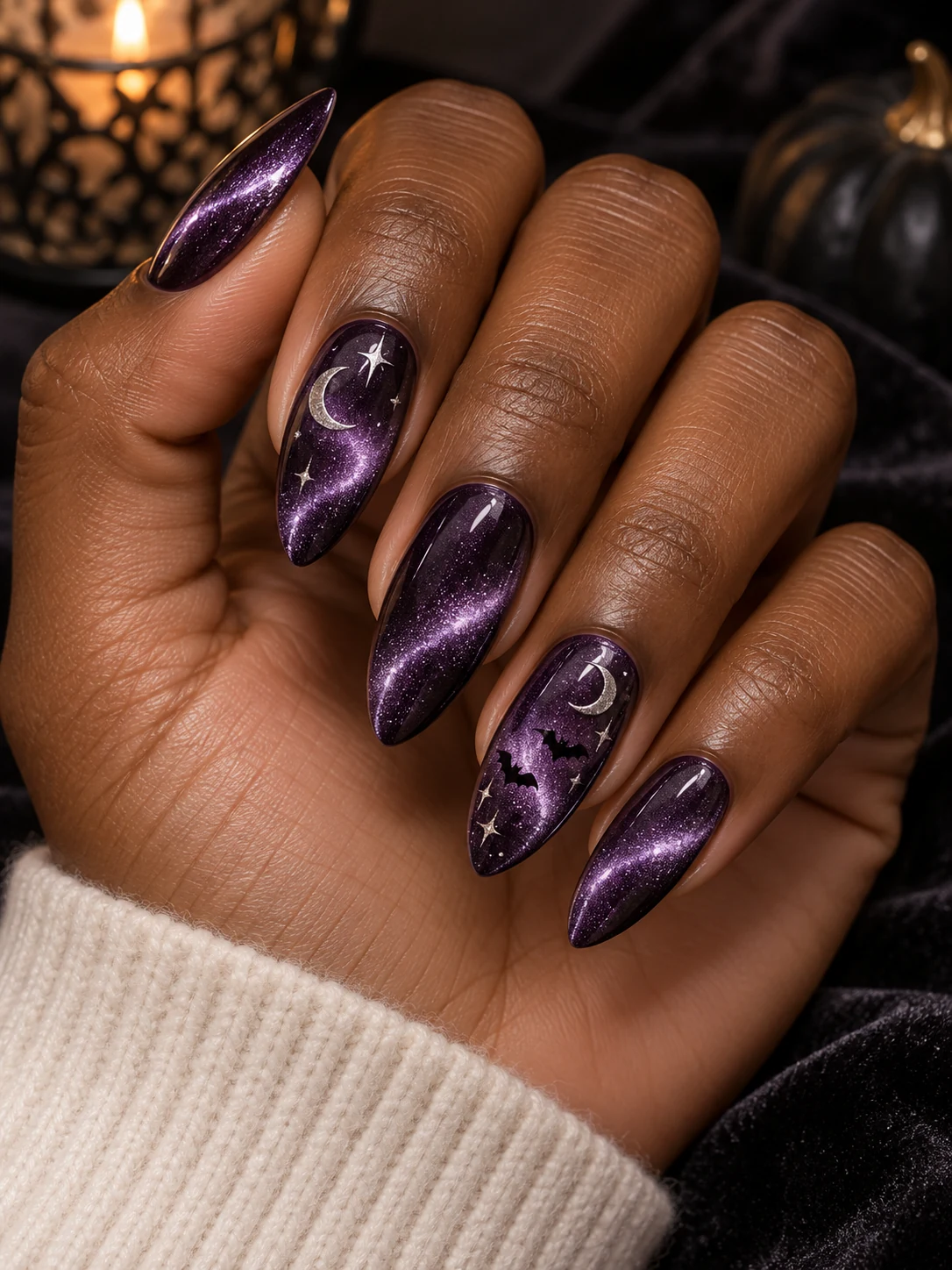 Violet magnetic cat-eye almond nails with silver moons and tiny black bats
