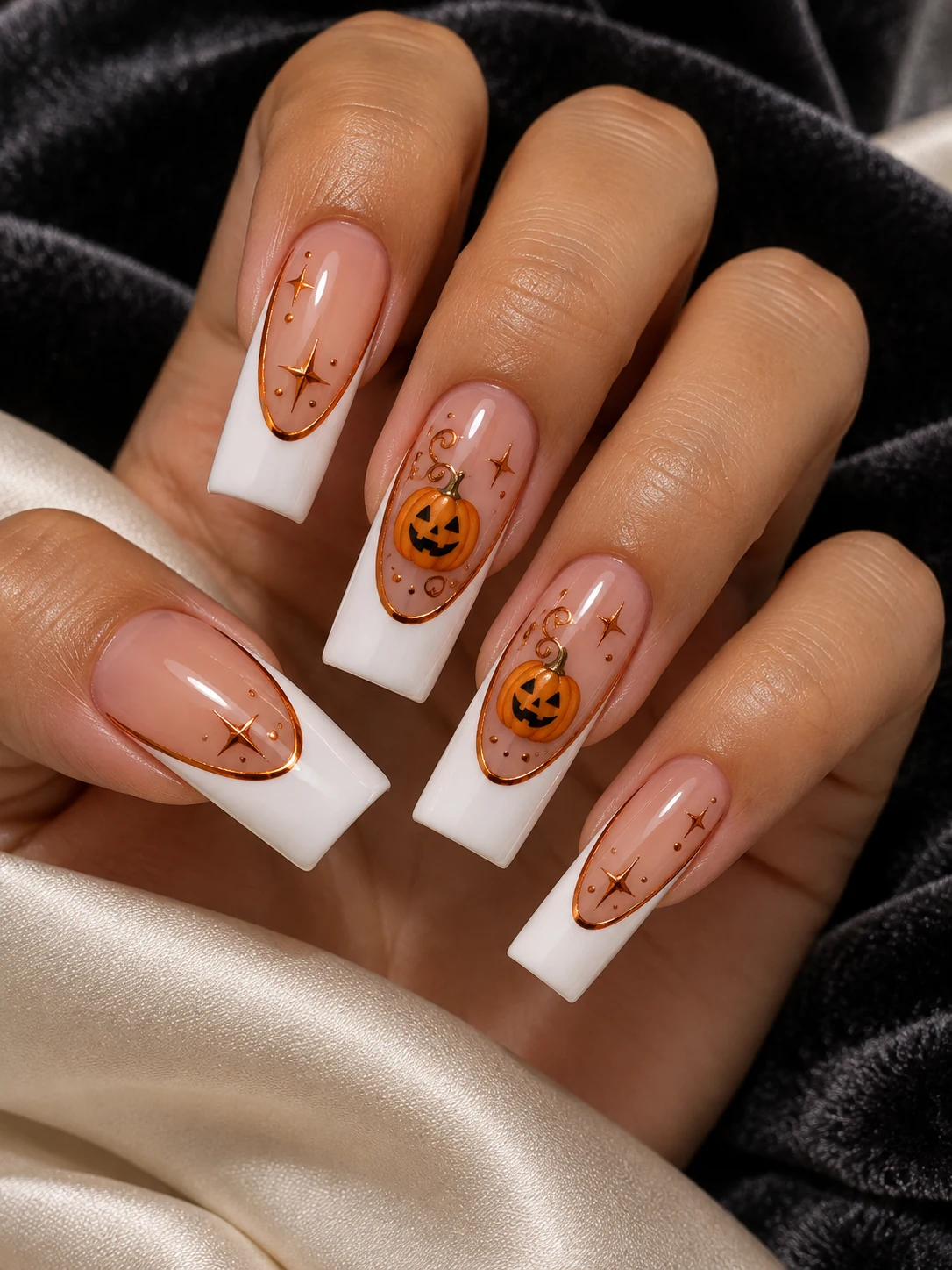 White dramatic French tips with copper chrome curves, smiling pumpkins and stars