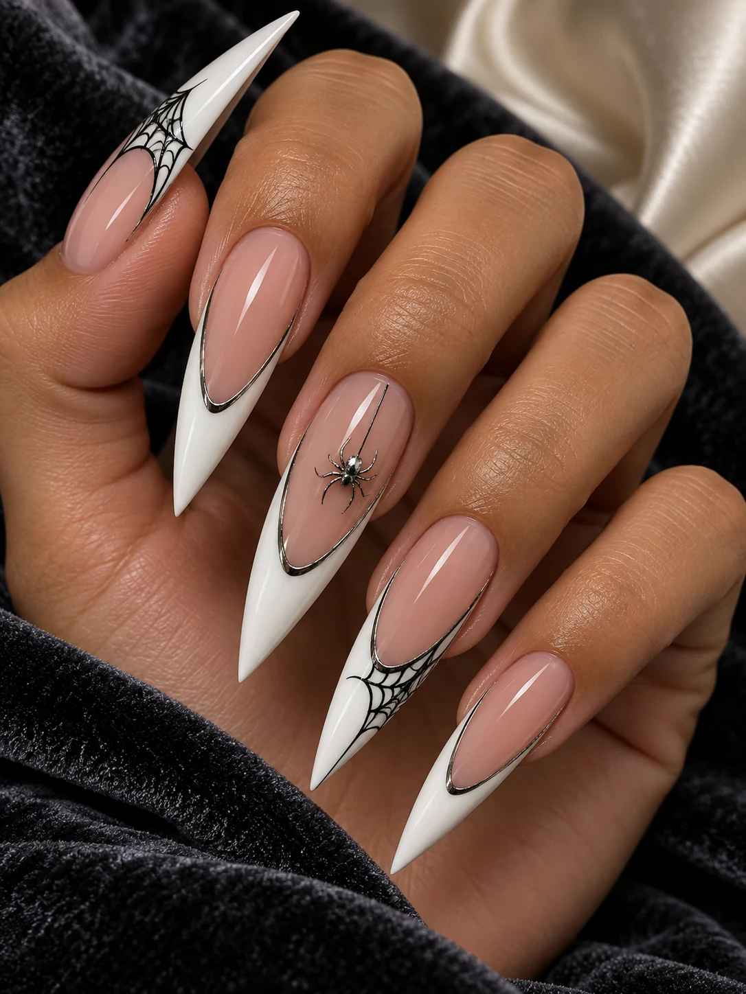 Extra-deep white stiletto French with gunmetal outlines, black webs and a silver spider